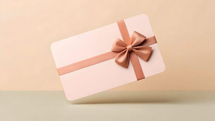 Elegantes Geburtstagsgeschenk mit rosa Schleife auf neutralem Hintergrund